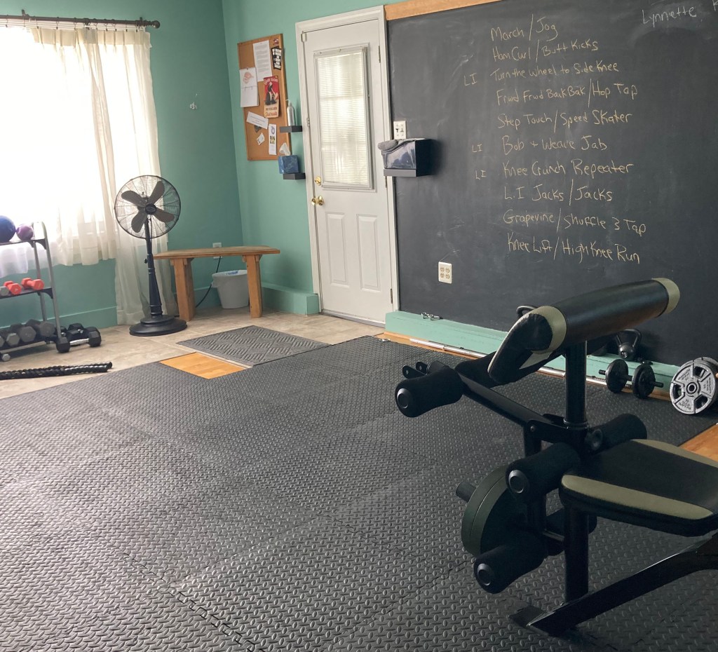 Workout studio equipped with various exercise equipment.